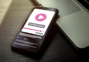 Smartphone displaying advertising video content